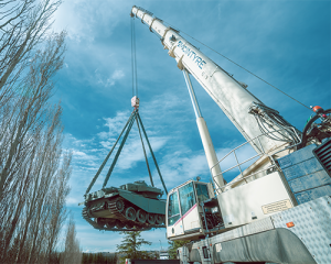 McIntyre Crane lifting a military tank using a mobile crane in Spruce Meadows Calgary, Alberta